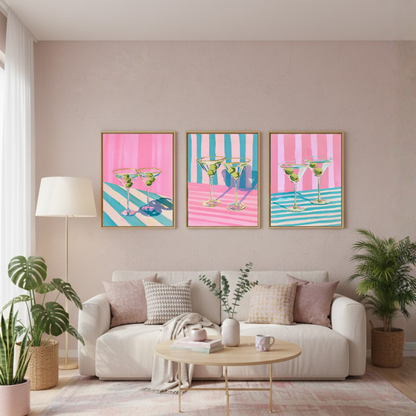 Living room with a white sofa, coffee table, and three colorful wall art prints of martini glasses.